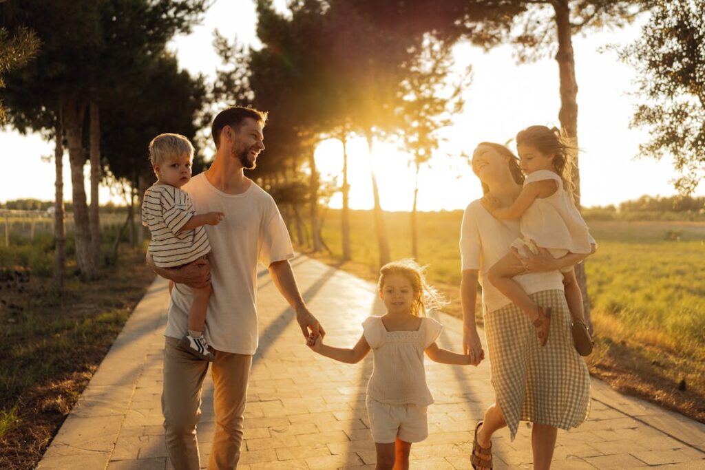 Free Photo Of Happy Family Walking On Sunlit Path At Sunset 1024x683